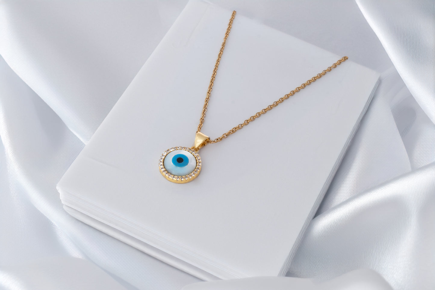 STUDDED EVIL EYE PENDANT